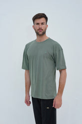 Essential summer green drop shoulder T-shirt for men – oversized fit, premium cotton, and a refreshing, stylish look.